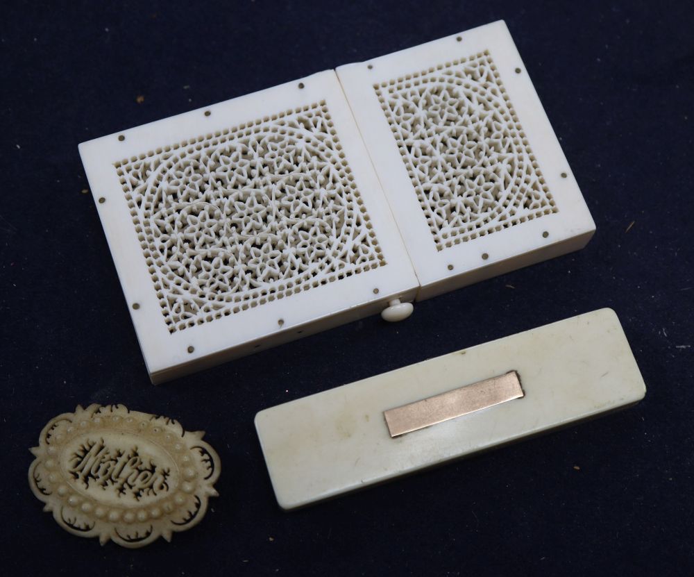 A Regency yellow metal mounted ivory toothpick case, a pierced card case, length 10.5cm and brooch
